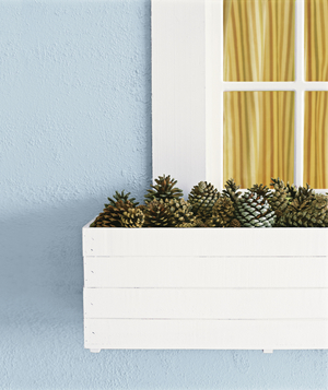 When autumn comes and the temperature dips, outdoor decorating becomes more challenging. Collect pinecones and pile them in an empty flower box for a pretty, no-maintenance display.